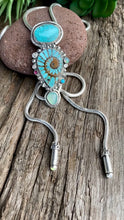 Load and play video in Gallery viewer, Turquoise Inlay Ammonite With Kingman Turquoise, Green Chalcedony, Opal And Ruby Bolo  Style Necklace - Bolo Tie

